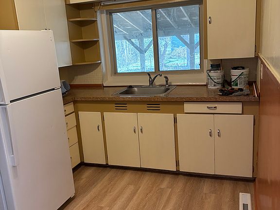 Kitchen with new flooring and ceiling fan