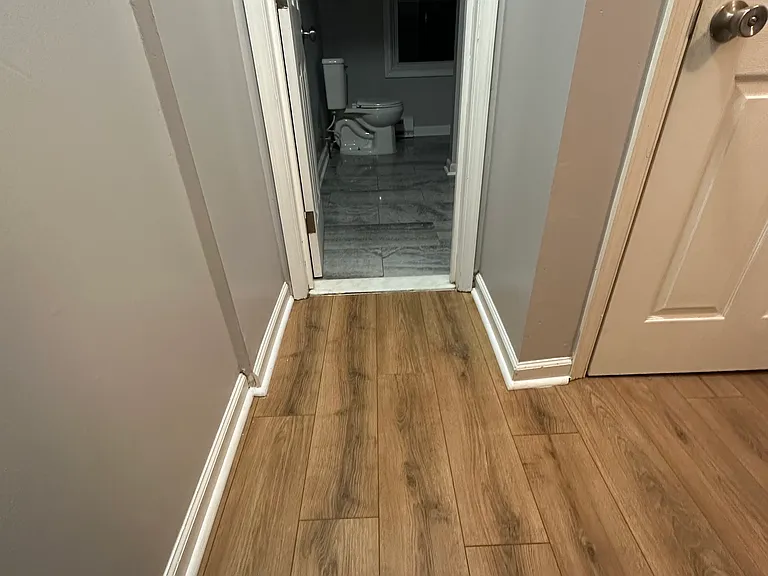 Full bath entryway and closet at top of steps