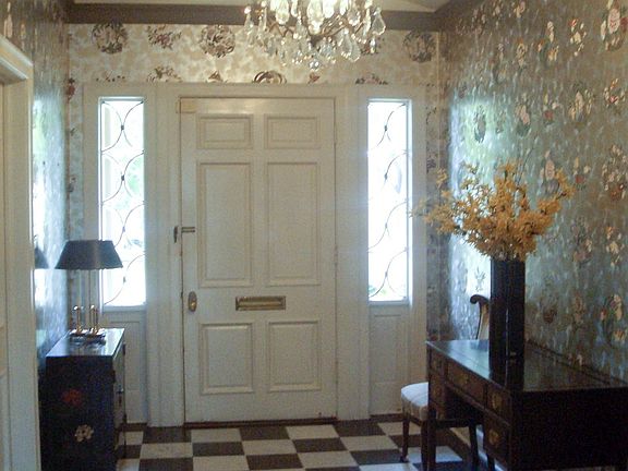 Entry hall with blk & wht checkerboard marble floor & barrel vaulted ceiling