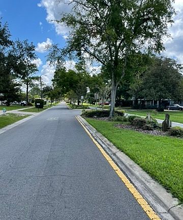 Quiet neighborhood, road divided by beautiful landscaping