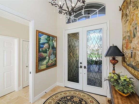 Luxurious detail do not stop as you open the glass leaded double door entry.