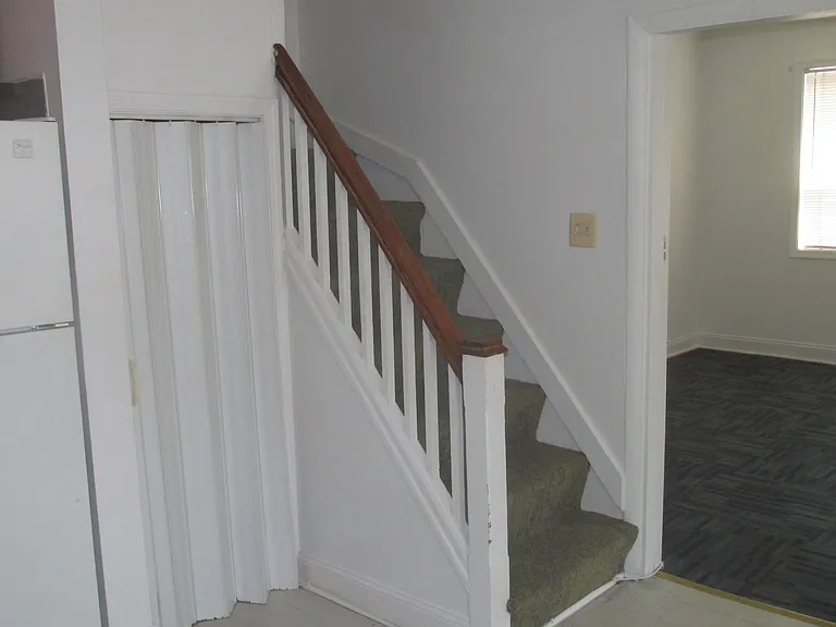 Closet under steps.