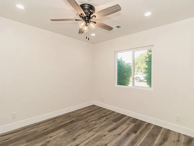 Bedrrom w/LVP Flooring, Dual Pane Windows, Fan and LED lighting.