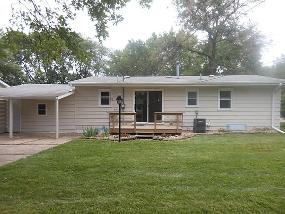 Back of house with deck & patio