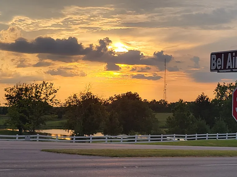 Directly across from Arlington Golf Course, this property offers the perfect setting to unwind with stunning sunset views just steps away.