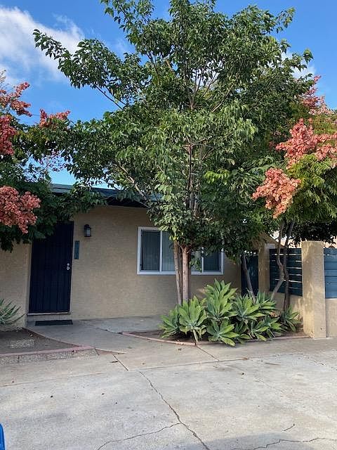 Front door of house with parking driveway