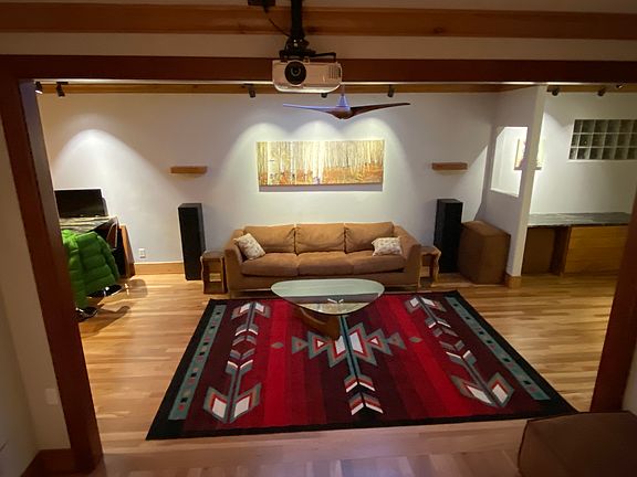 Den with TV projector at top