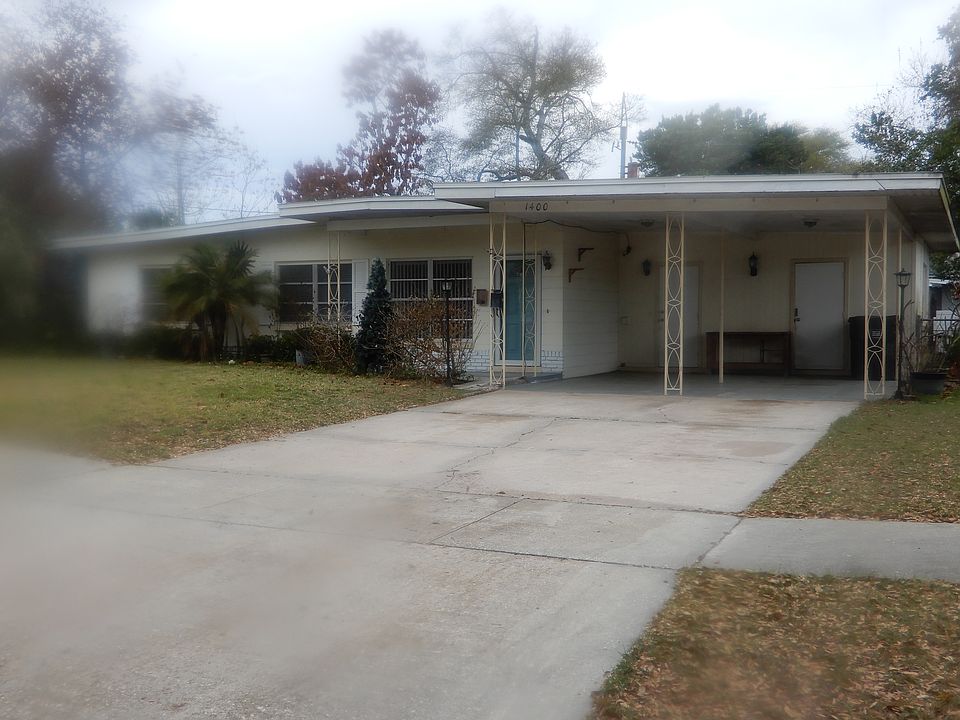 Frontal view of property which faces East. Long concrete driveway for lots of off-street parking for visiting family and friends.