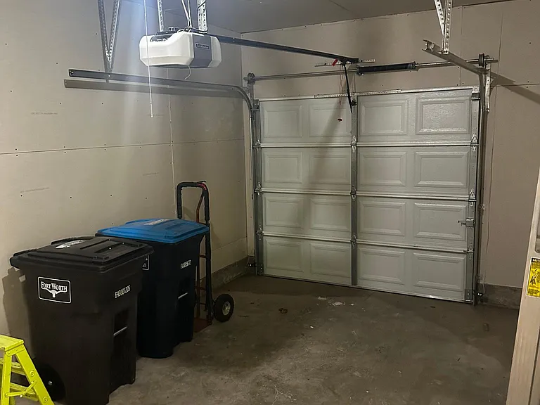 Single Car Garage with washer and dryer connections in the right side cove. Garage has direct access to the kitchen/dining area as well as the backyard.