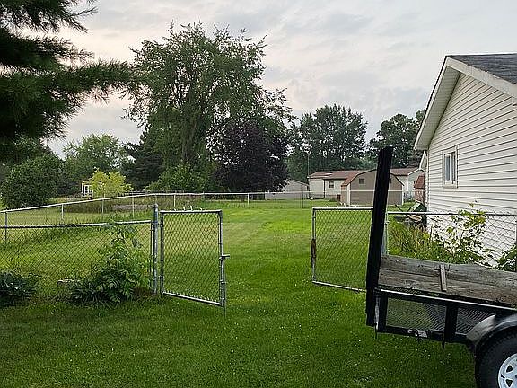 Side of house with dbl gate