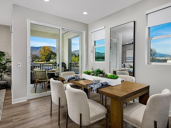 A photo of the Dining and Covered Deck in the Plan 3 model home at Magnolia in Arcadia.