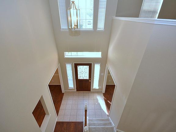 The view from the second story showing the impressive and inviting foyer.