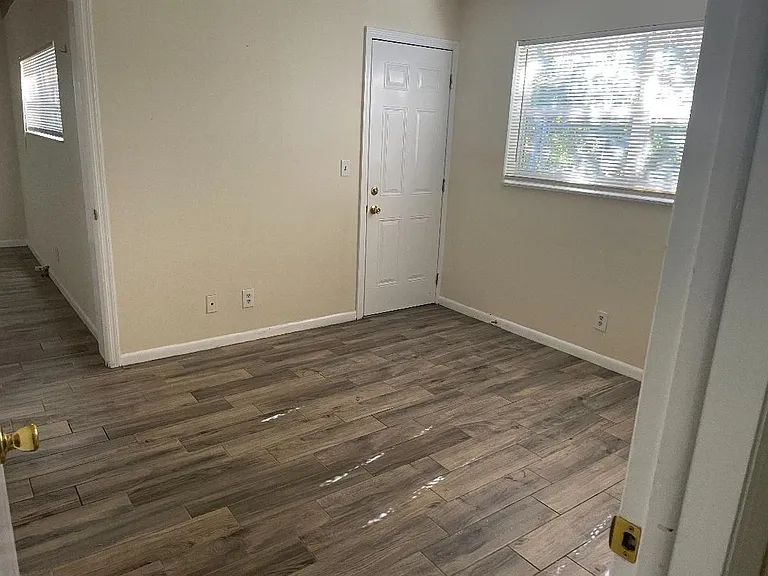 Bedroom 2 and Door to Back Yard (impact resistant door with lock)