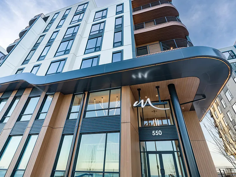 A bold exterior entry with clean lines and a welcoming, modern presence.