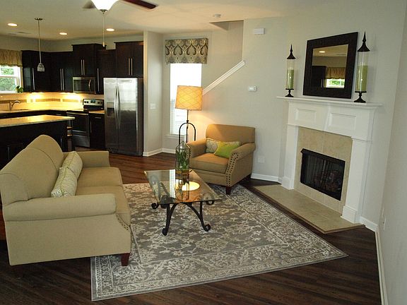 open concept downstairs with gas fireplace. laminate flooring downstairs.