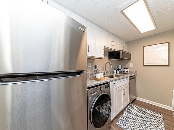 Kitchen with granite counters and modern cabinetry