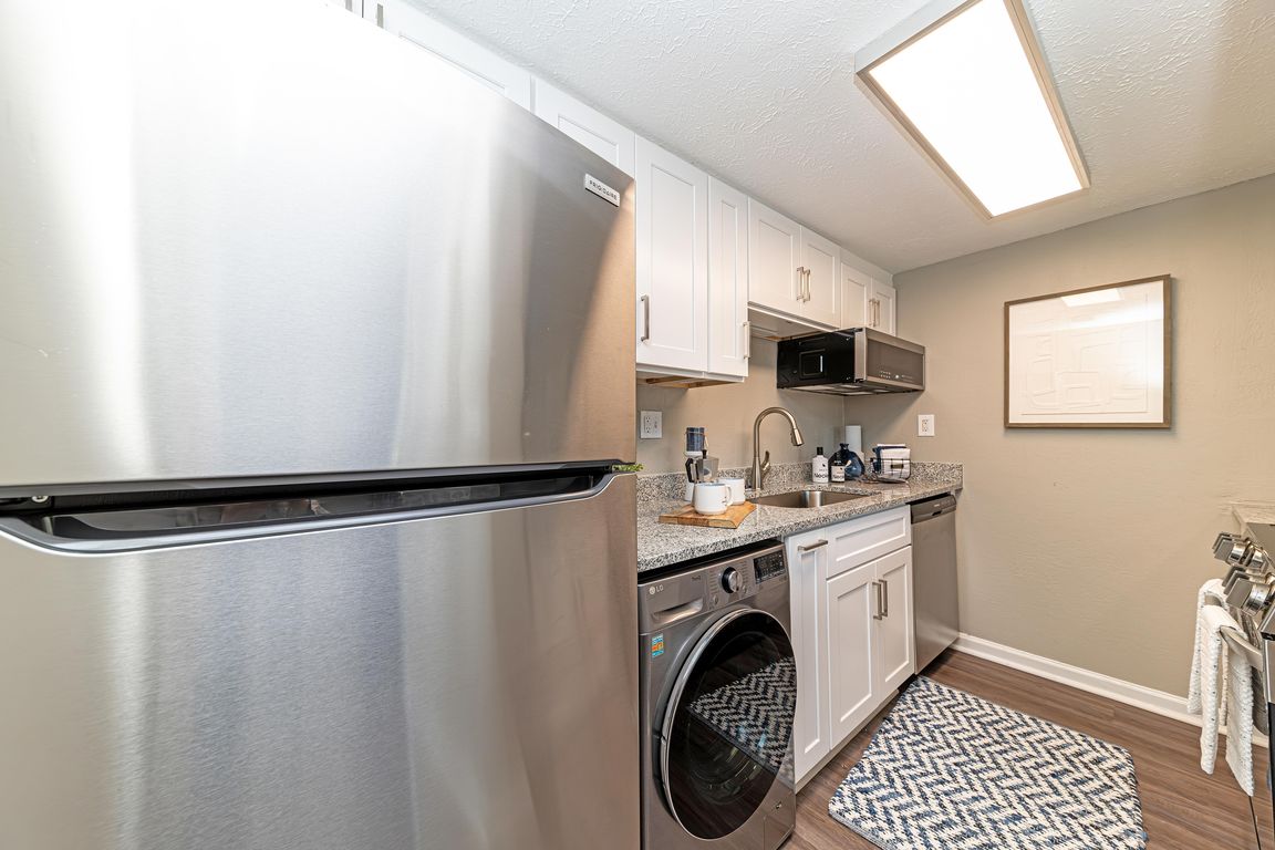 Kitchen with granite counters and modern cabinetry