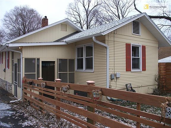 REAR VIEW OF HOUSE WITH SCREENED PORCH