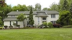 Front View Lush Professionally Landscaped Front and Backyard