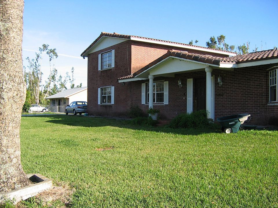 Located in up scale Plantation Acres- Full acre with a guest house and pool.