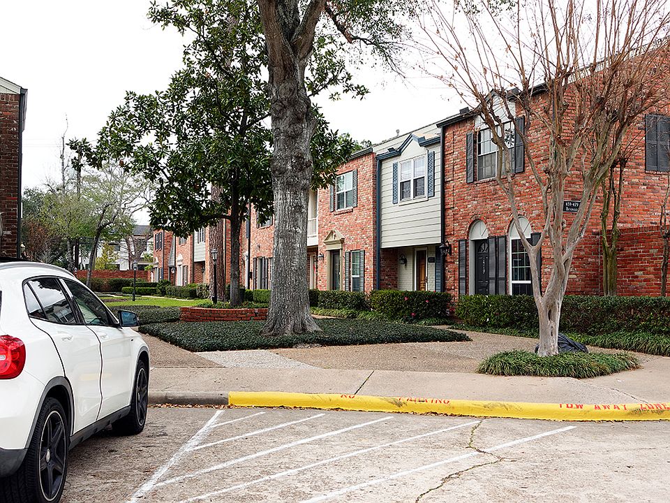 The home is the white house. One car garage is at back. Common parking in front.