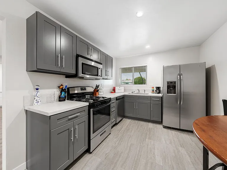 Kitchen - New cabinets and quartz countertops.