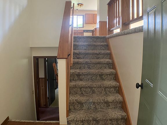 Front entrance with stairs to upper and lower levels