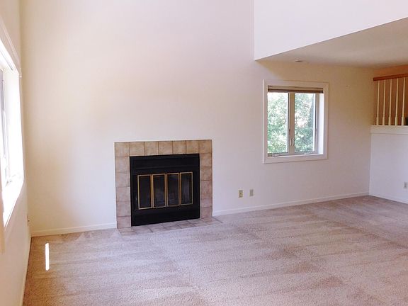 Living Room with Vaulted Ceilings and Fireplace