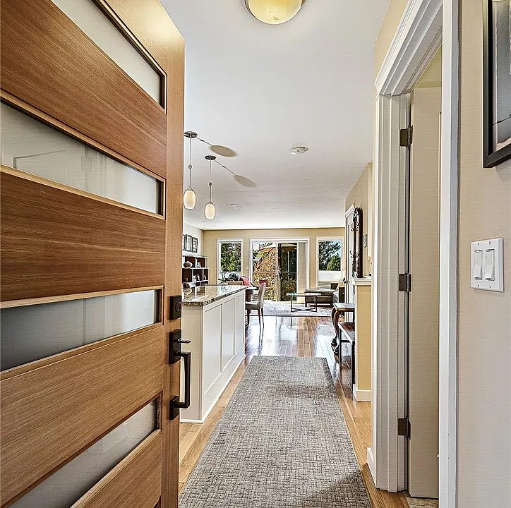 When you see through to the deck and trees from the front door, you appreciate the outdoors even from the indoors in this end-unit townhome.  Walk through in 3D by clicking the Virtual Tour link!