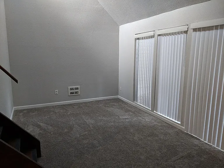 Living room with sliding door access to back patio.