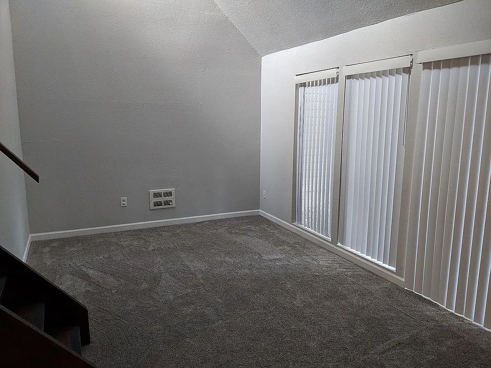 Living room with sliding door access to back patio.