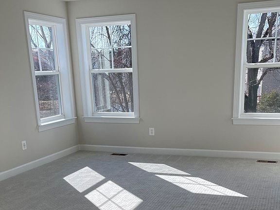 Carpeted owner s suite with multiple windows at a DRB Homes Newbury II plan at the Barron Heights co