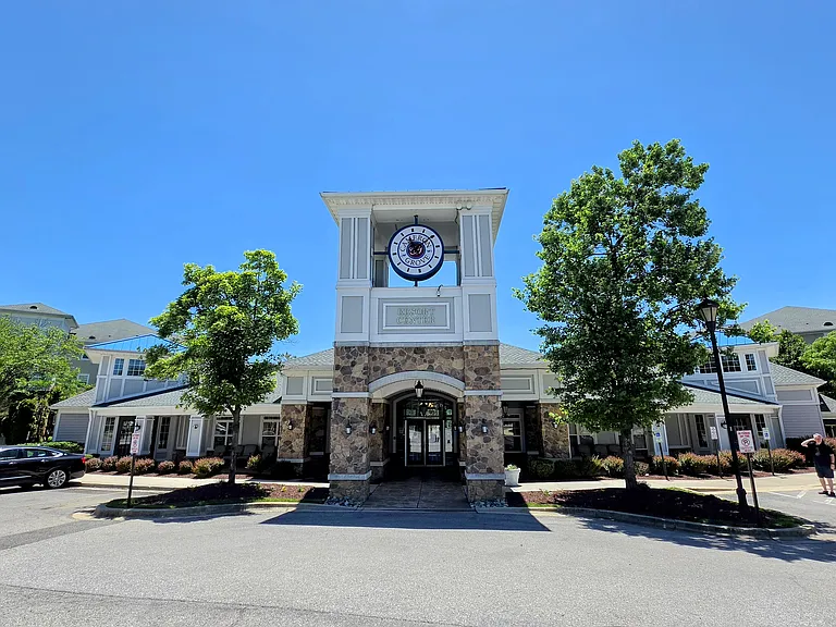 The neighborhood's grand, resort-style community center_a central hub for resident activities and social gatherings.