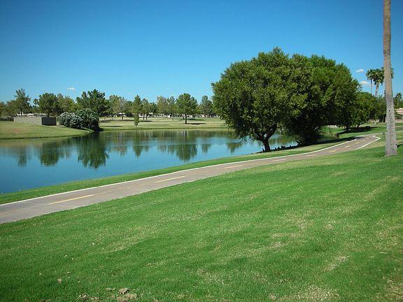 Adjacent to miles of walking paths w/water, mountain & golf course vews!
