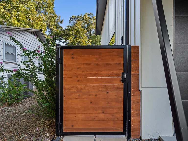 Gate with a keypad leads to the casita.