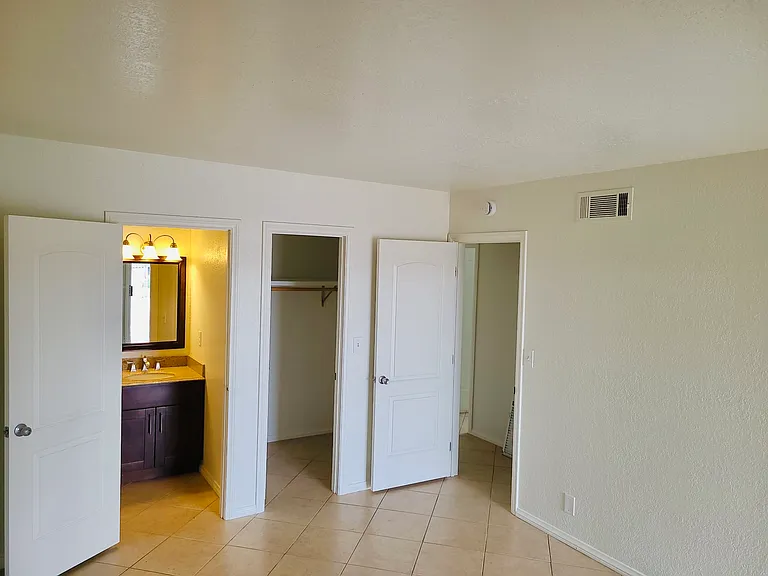 Primary Bedroom with Half Bath and Walk In Closet