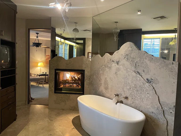 Fireplace from master bedroom enjoyed also at 6' bathtub