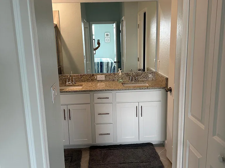 Master bath. Granite, walk in tiled shower, his and hers closets.