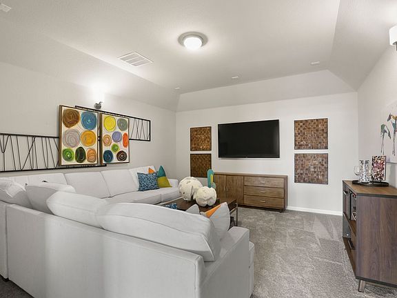 Media room in the Masters Plus home plan by Trophy Signature Homes - REPRESENTATIVE PHOTO