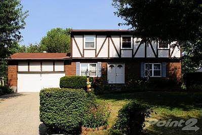 Newer entry doors include leaded glass accents.