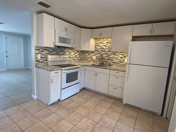 New microwave, Glass top stove, new refrigerator, food disposal.