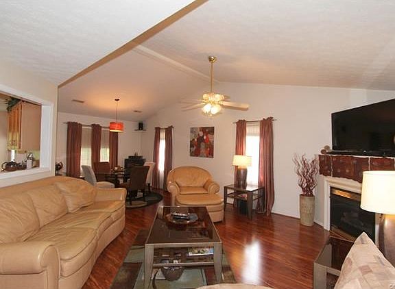 Living Room with Kitchen Pass-Through and Dining Area
