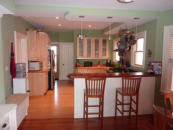 View of breakfast bar and kitchen
