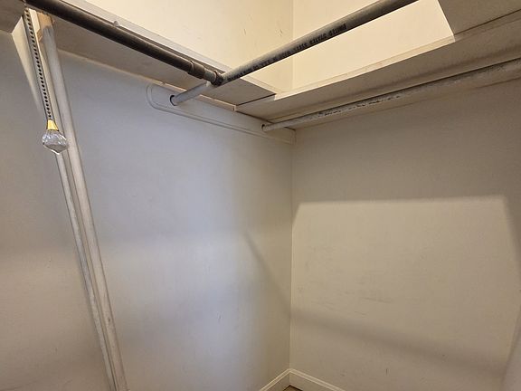 Walk-in. Triple rods and shelving and floor space.