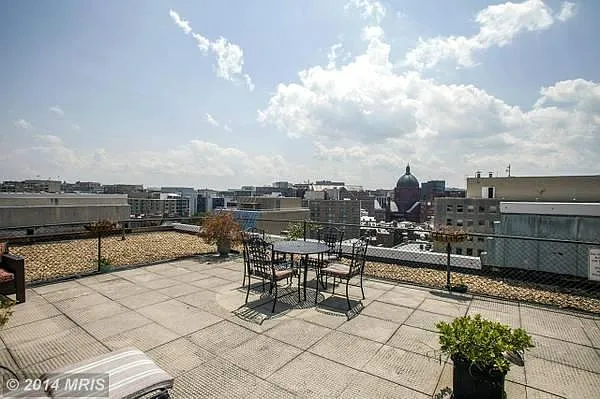 Rooftop with breathtaking views, lounge chairs, barbeque grills