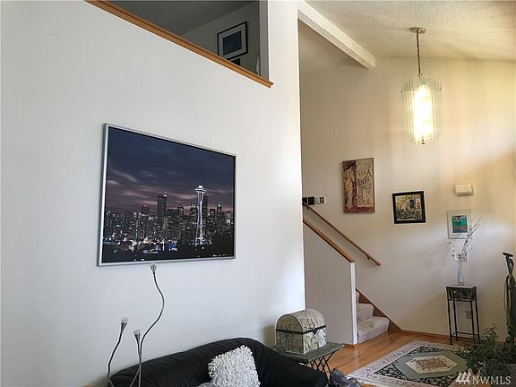 Upon entry you are greeted with 2-story ceilings and the formal living room. Gleaming hardwood floors sweep from the entry to the kitchen and family room.