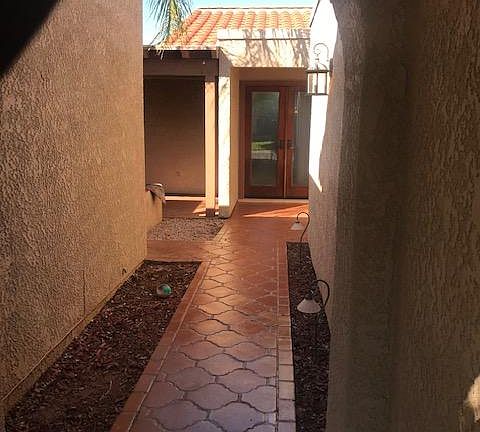 Walk way to front door. Casita is on the left of the walkway. Garage is on the right of the walkway