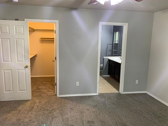 Master suite with walk-in closet. Bath has tub/shower and two sinks.