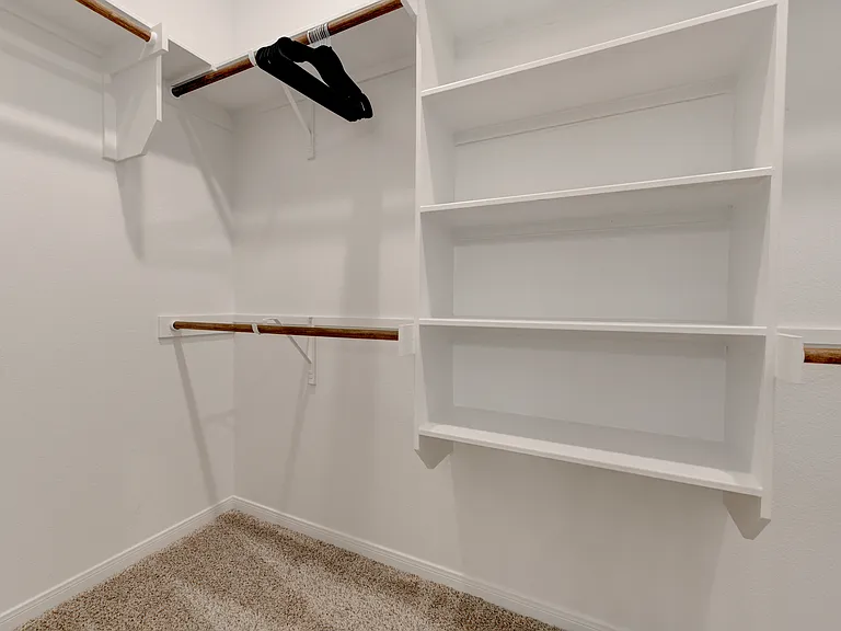 Full closet in bedroom