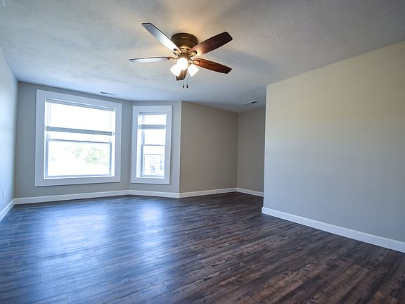 Large living area is open to the front bay windows as well as the kitchen. The nook provides a convenient location for a work desk or other furnishings.